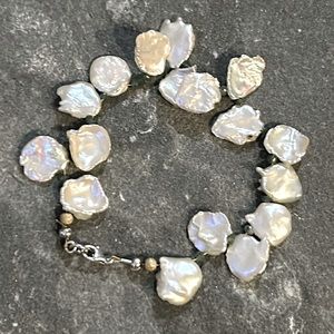 Gorgeous Petal Freshwater Pearl and Peridot Bracelet. It’s light and delicate.